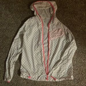 Girls small raincoat. Polka dotted with a pocket. Never worn.